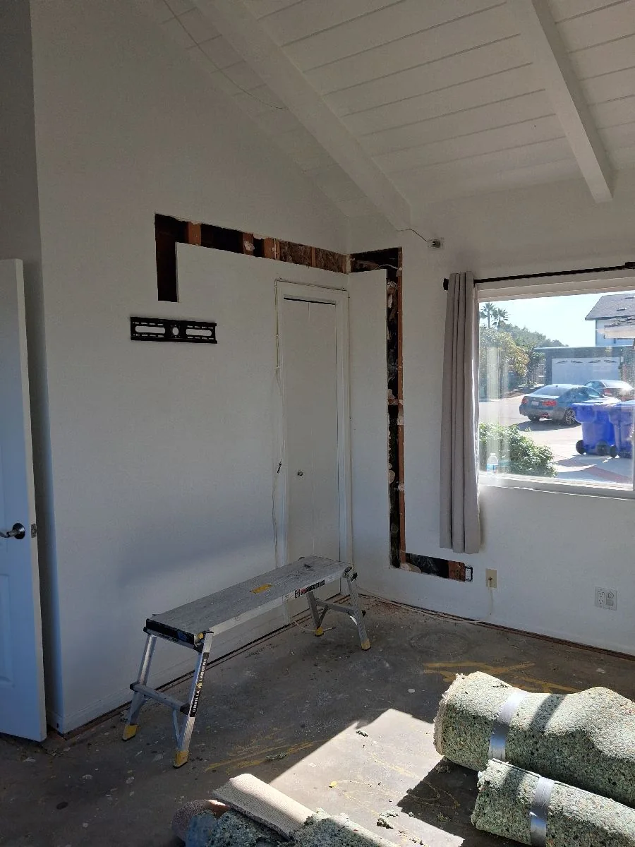 Interior room opened for renovation with floor protection and work platform